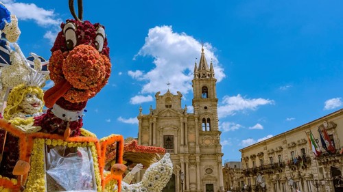 The puppet smiling flower in a Sicilian square