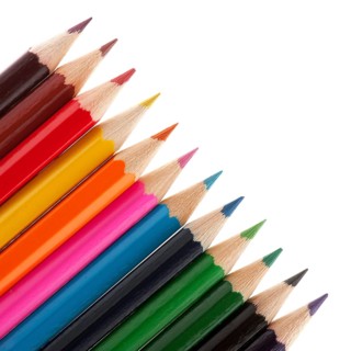 Row with color pencils on white background