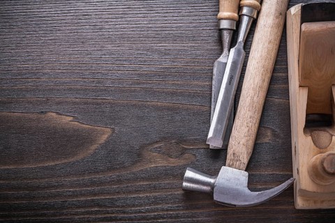 Copy space image of joiner's tools on vintage wooden board construction concept