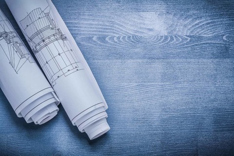 Copyspace image white rolled blueprints