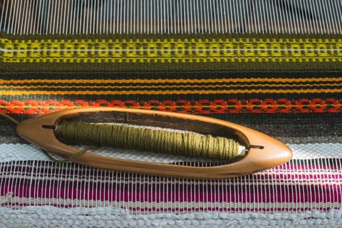 Vintage loom and yarn. Knitting carpet