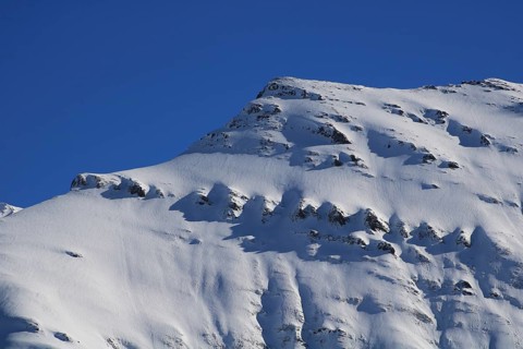 Mittaghorn mountain in winter, Elm