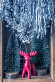 An image of some Christmas decoration in an old wooden box