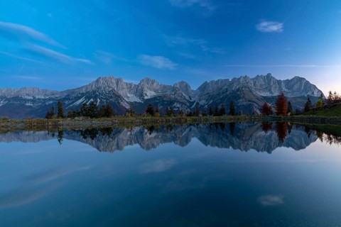 Wilder Kaiser reflected in the Astbergsee in the early morning, Going, Tyrol, Austria