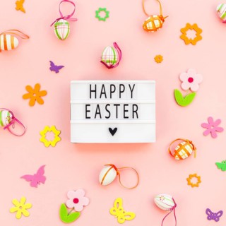 Creative Top view flat lay holiday composition Happy Easter text on lightbox pink paper background