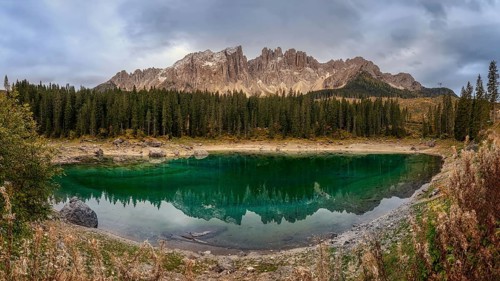 Karersee is located in the Latemarwald forest in the upper part of the Eggental valley, of the city