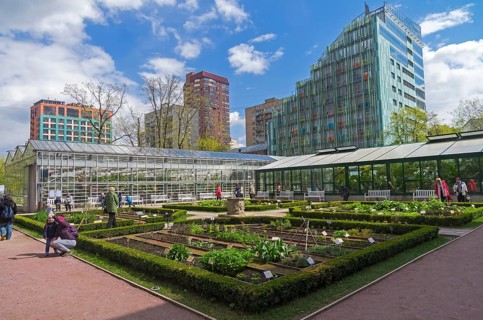 MOSCOW, RUSSIA, MAY 13, 2017: Garden beds with medicinal plants and greenhouses in Aptekarsky