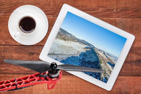 Aerial landscape photography concept - reviewing aerial pictures of a mountain valley in Colorado