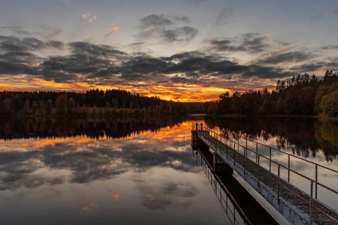 Sunset over a lake Atmospheric landscape shot from the Harz Mountains