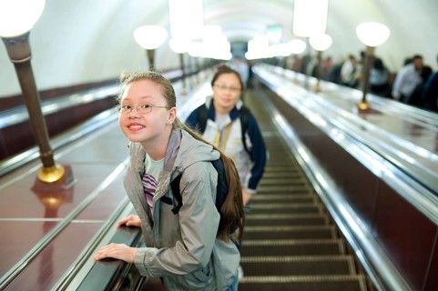 A girl (11 years) lifts on a metro escalator