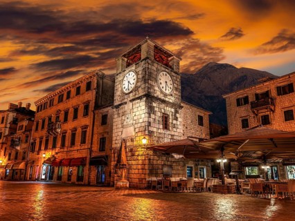 Clock tower on central square of Old Town in Kotor in early morning, Montenegro