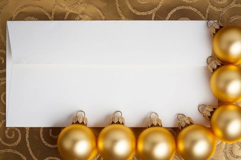 Blank paper card framed Christmas balls on gold
