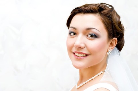 Young charming bride looks into camera, closeup