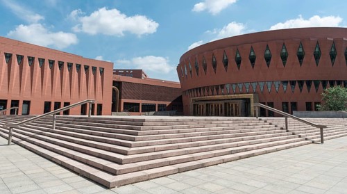 Beijing, China June 1 2018: Green gardens and the Libray Building of the famous Tsinghua University