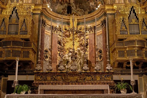 The ornate Baroque main altar and organ of St. John Co-Cathedral, Valletta, Malta