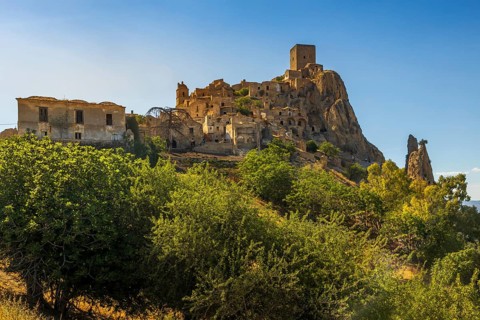 A picturesque view of the abandoned, old mountain town of Craco, built of sandstone rock. Craco is