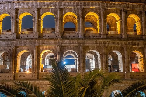 The Colosseum, famous and unique historical building of the Eternal City. View in the morning with