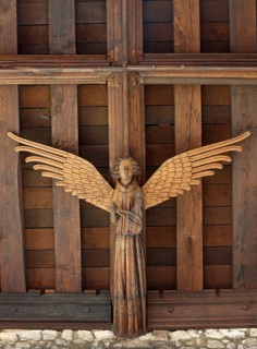Musical wooden angel with viol (viola da gamba) on the ceiling in the south aisle, around 1430, St