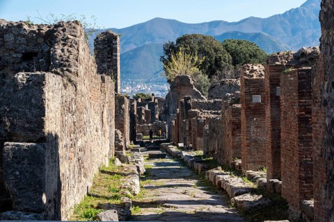 POMPEII, ITALY, MAY 04, 2022, A beautiful typical cobbled street in the ancient city of Pompeii,