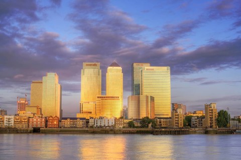 Canary Wharf District at sunrise. Canary Wharf is a commercial estate on the Northern side of the