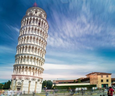 Leaning Tower of Pisa. Blue cloudy sky background