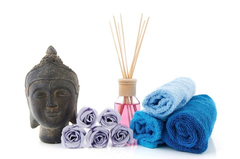 Stilllife with wellness items as buddha towels and scented sticks