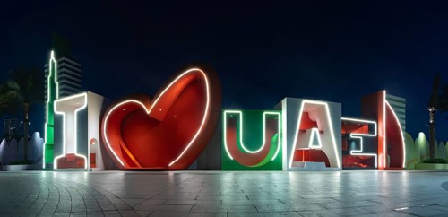 A picture of the I Love UAE sign at night
