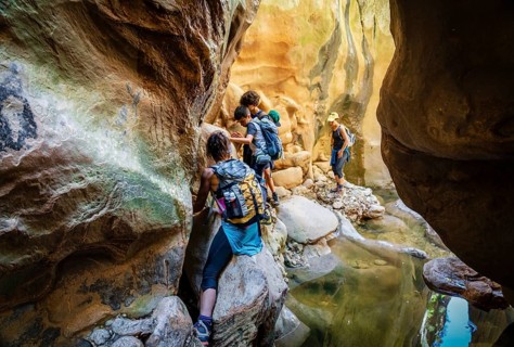 Walkers dodging waterlogged stretches, Torrent de Pareis, Sa Calobra, Majorca, Balearic Islands,