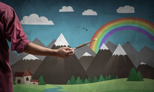 Close up artist hand holding paintbrush. Painter in shirt standing on background colorful picture.