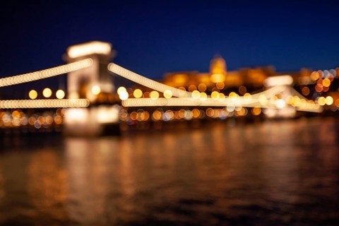 Blurred chain bridge in Budapest at night. Hungarian landmarks. Danube river