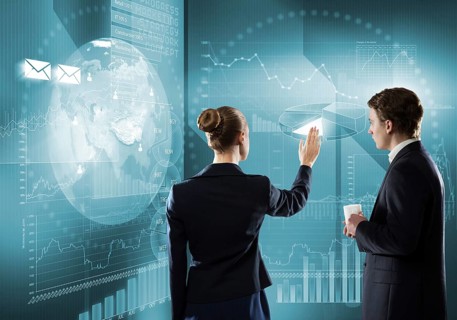 Rear view of businessman and businesswoman working with virtual panel interface