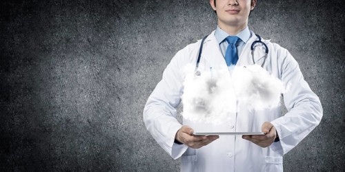 Cropped image of successful young medical industry employee in white sterile suit presenting cloud