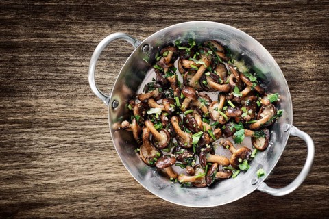 Fried shiitake mushrooms in garlic herb and olive oil tapas snack