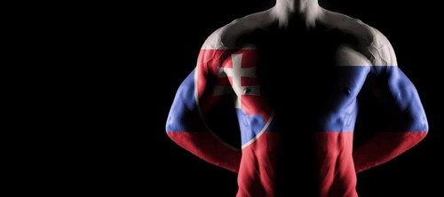 Slovakia flag on muscled male torso with abs, black background