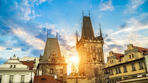 Malostranska Tower on Charles Bridge and morning sun in Prague
