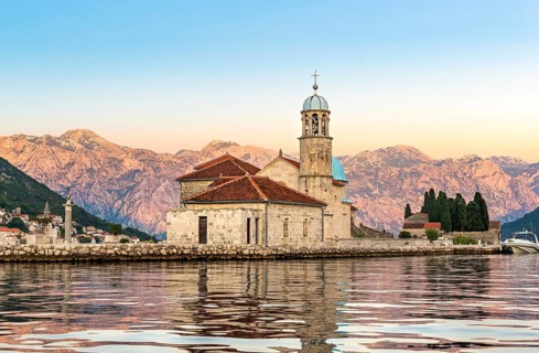 Dawn over Our Lady of the Rock island in Perast, Montenegro