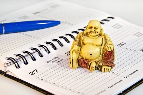 Buddha statute sitting on schedule in the office