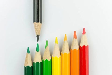 Conceptual crayons represented as successor energy label colors with black pencil that indicates