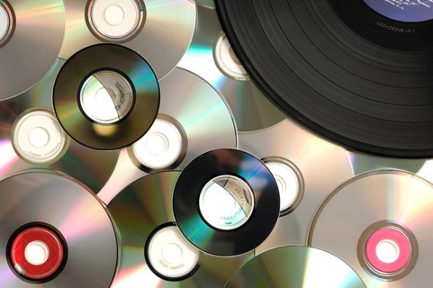 Compact disks and vinyl record abstract background