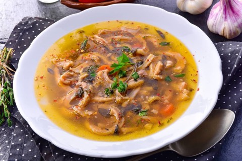 Traditional Politur-style tripe soup with beef and vegetables