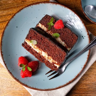 Rustic chocolate cake with raspberries and coffee