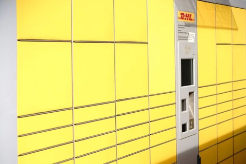 Mainz, Germany - May 27, 2017: Lockers or stacked and lined up parcel boxes with a DHL customer