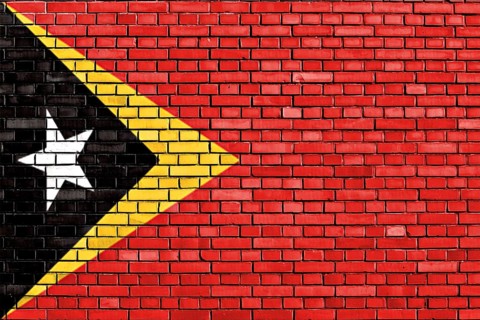 Flag of East Timor painted on brick wall