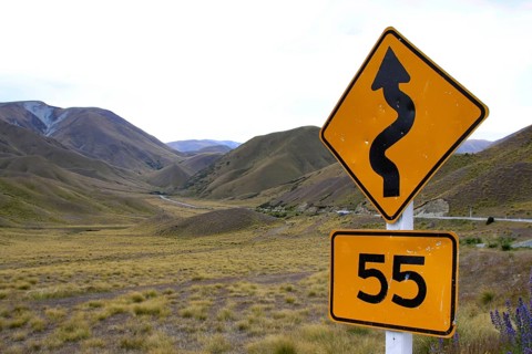 Traffic sign in New Zealand indicating a road with bends
