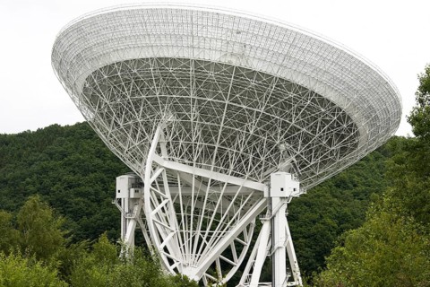 The photo shows a radio telescope