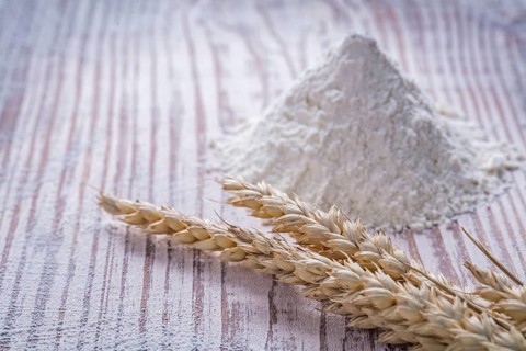 Rye wheat ears flour on wooden background food and drink concept