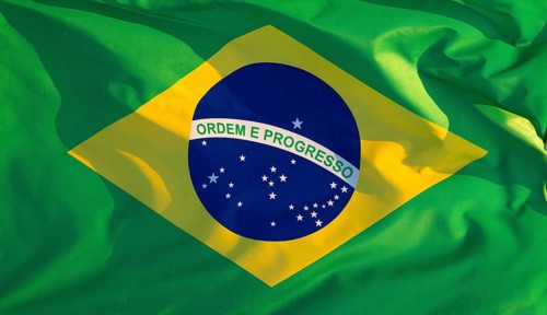 Brazil's national flag flutters in the wind in the evening light