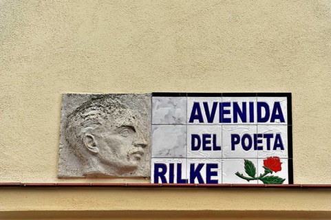 Memorial plaque on a wall with a relief image and Rilke's name, Ronda, Malaga province, Andalusia,