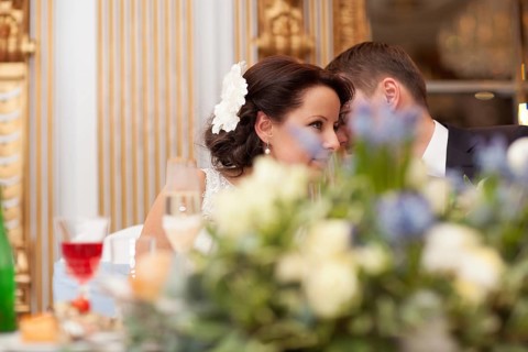 Bride and groom sharing a special tender moment at the wedding leaning with their heads close