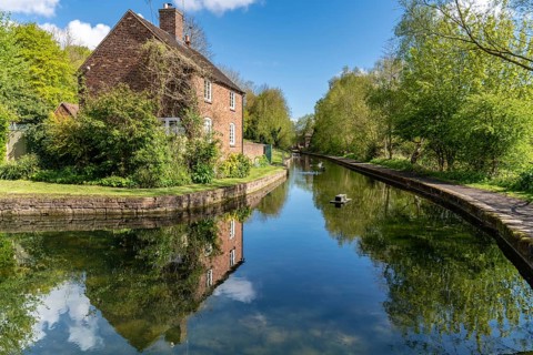 Coalport, Shropshire, England, UK, May 02, 2018: A house near the shore of the Old Canal